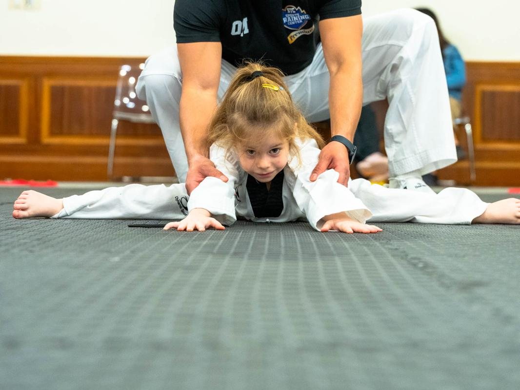 Coach and athletes on the training floor
